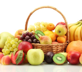 Naklejka na ściany i meble Assortment of exotic fruits in basket isolated on white