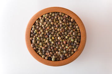 Legume Roveja seeds on a wooden jar
