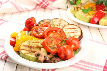 Delicious grilled vegetables on plate on table close-up