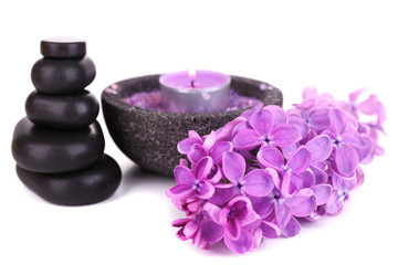 Composition with spa stones and lilac flowers, isolated on