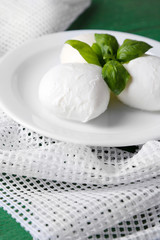 Tasty mozzarella cheese with basil