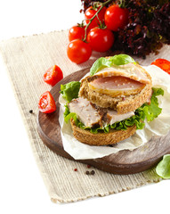 Delicious sandwiches with meet on table close-up