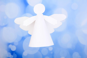 Christmas angel on bright background