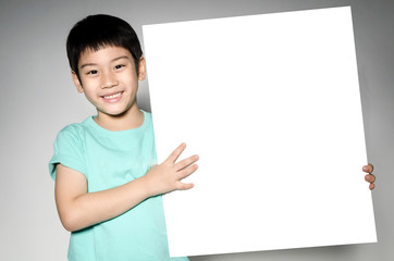 Asian cute boy with big white  blank plate  for add your text .