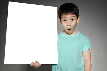 Asian cute boy with big white  blank plate  for add your text .