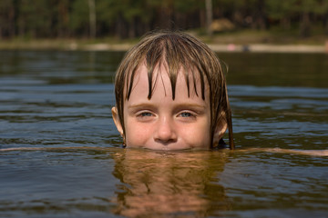 Young beautiful girl in water