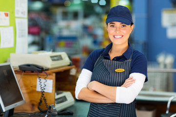 female hardware store cashier with arms folded