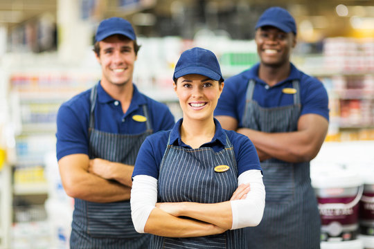 female hardware store worker and team
