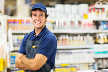 male supermarket worker with arms crossed