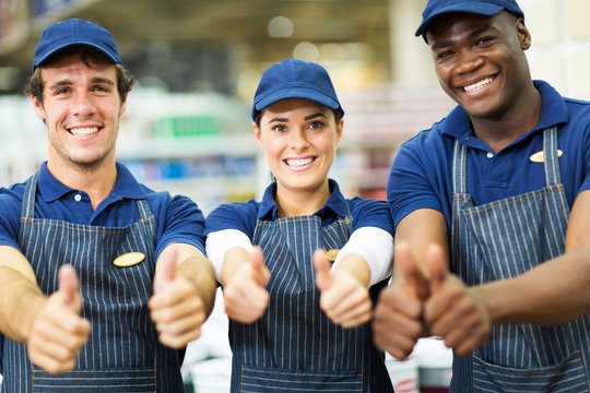 group of supermarket workers thumbs up
