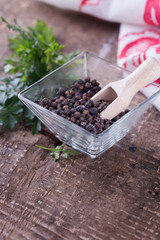 Black  pepper  on wooden background