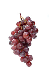 Fresh red grapes isolated on white background.