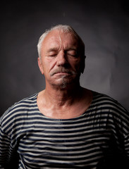 Portrait of a wet man on whom pours water