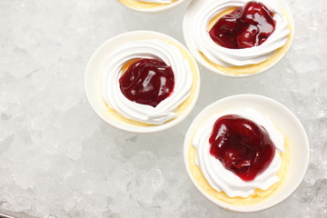 mini cherry cheese cake in white cup