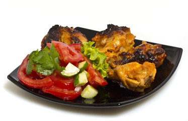 Fried chicken with salad isolated on white background