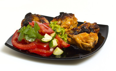 Fried chicken with salad isolated on white background