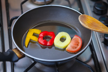  Food word written with letters formed from vegetables 