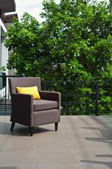 Outdoor patio seating are with nice Rattan sofa at sunset