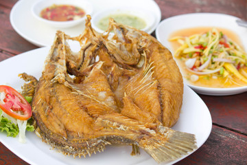 Fried snapper with chili sauce on the plate