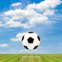 soccer ball with soccer field against  blue sky background