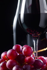 grape and glass with red wine