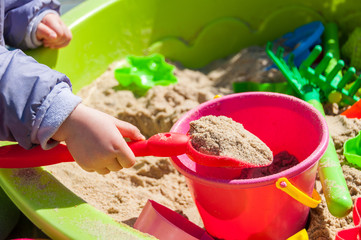 Child playing in sandbox