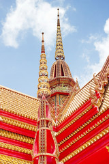 Thai Buddhist art temple with blue sky at Kanchanaburi Thailand.