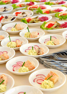 Assorted individual salads on a buffet