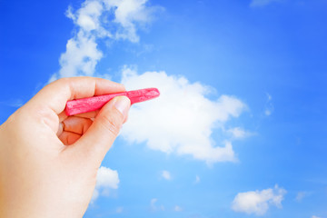 Hand writing with chalk on blue sky
