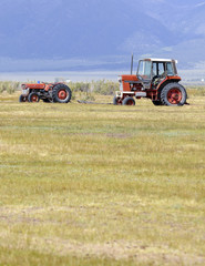 Tractor and Equipment on Farm in Rural Landscape