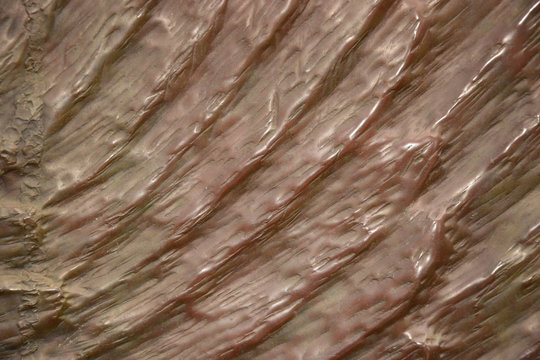 Uneven bronze surface as background