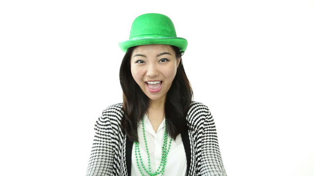 asian girl isolated on white ready for st patrick's day with