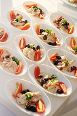 Bowls of fresh vegetable salad on a buffet table