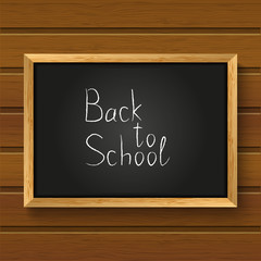 School blackboard on wooden background