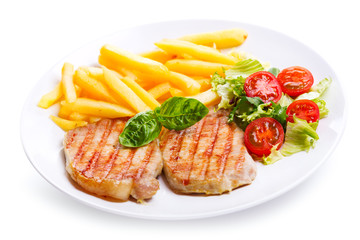 plate of grilled meat with vegetables