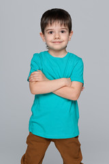 Little smiling boy in the blue shirt