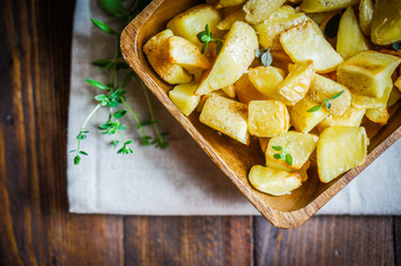 Baked potatoes on wooden background