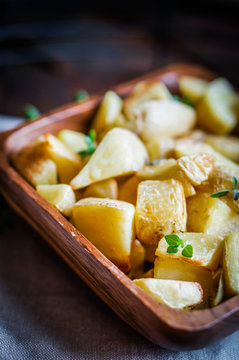 Baked potatoes on wooden background