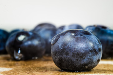 Blueberries with water drop on wooden table