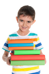 Laughing young boy with books