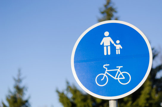 bicycle and pedestrian lane road sign in blue