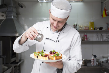chef preparing food in the kitchen at the restaurant