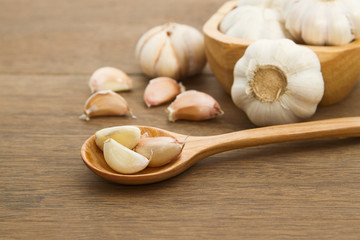 Fresh garlic on wooden background