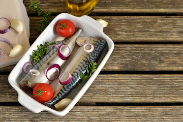 Fototapeta na wymiar Fresh fish mackerel with spices, herbs, vegetables