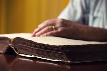 Male Hand On Bible