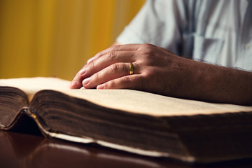 Male Hand On Bible