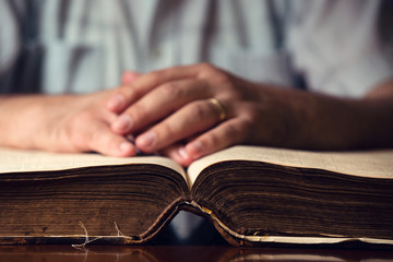 Male Hand On Open Bible