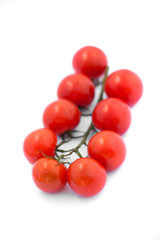 Bunch of fresh tomatoes with water drops