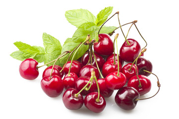 Fresh Cherry and leaves of mint on the white