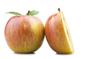 Red apple and leaves on the  white